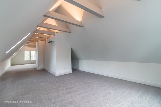 bonus room with a wall mounted air conditioner, carpet, and vaulted ceiling with beams