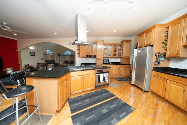 kitchen with island exhaust hood, tasteful backsplash, stainless steel oven, light hardwood / wood-style flooring, and white refrigerator