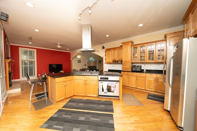 kitchen featuring oven, tasteful backsplash, ceiling fan, fridge, and light hardwood / wood-style flooring