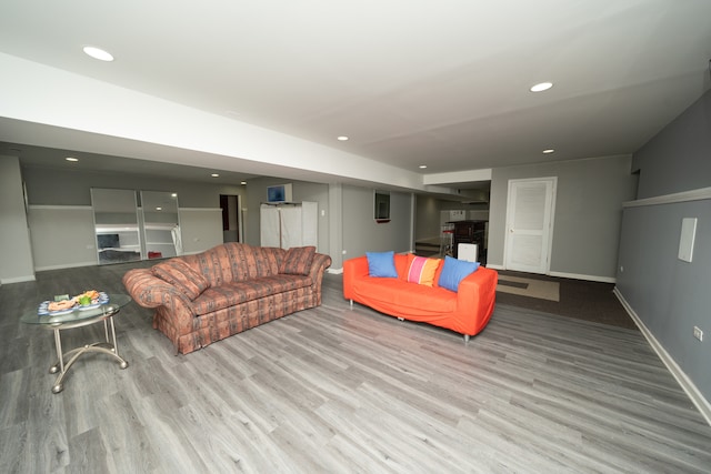 living room with light hardwood / wood-style floors