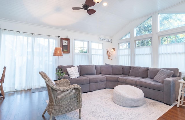 living room with crown molding, lofted ceiling, hardwood / wood-style floors, and ceiling fan