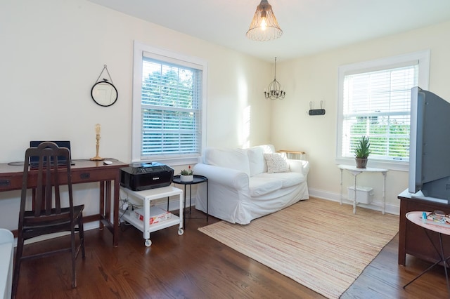 office area featuring an inviting chandelier and dark wood-type flooring