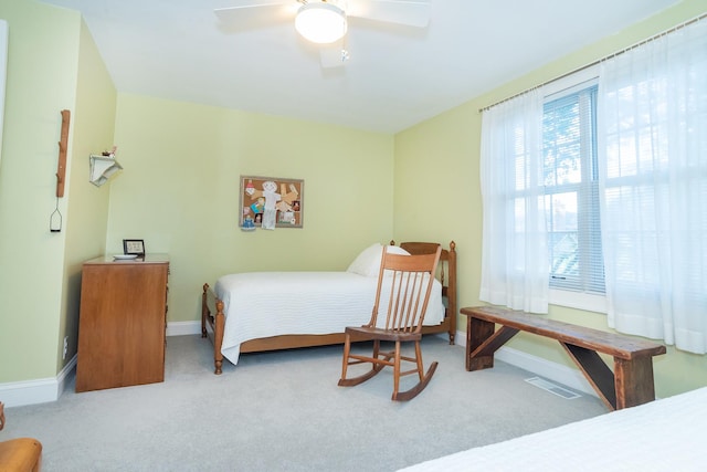 bedroom with ceiling fan and carpet floors