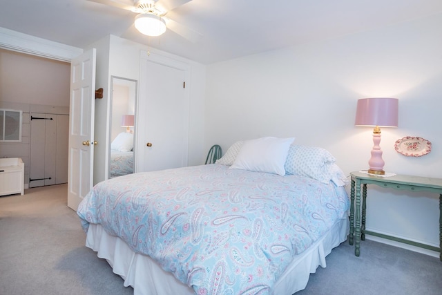 bedroom with ceiling fan and carpet