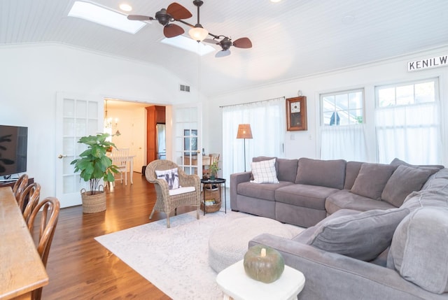 living room with lofted ceiling with skylight, wooden ceiling, ornamental molding, dark hardwood / wood-style floors, and ceiling fan