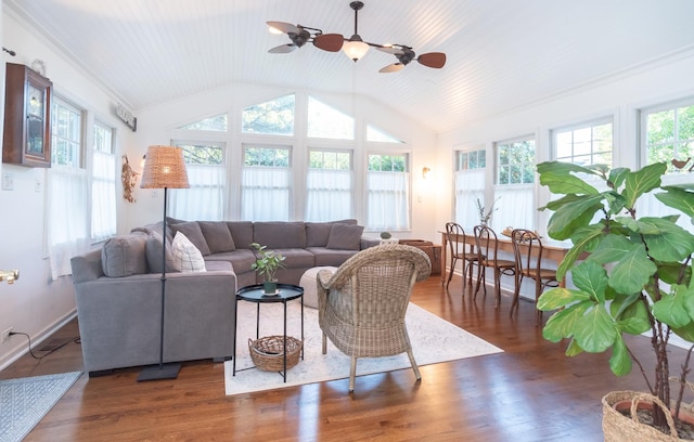 living room featuring vaulted ceiling, dark hardwood / wood-style floors, and ceiling fan