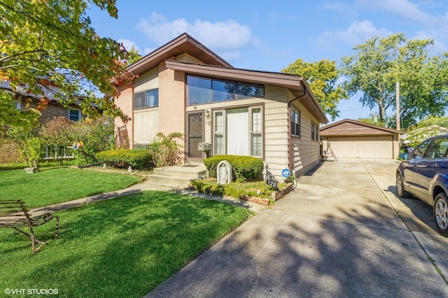 view of front of house with a front lawn, an outbuilding, and a garage