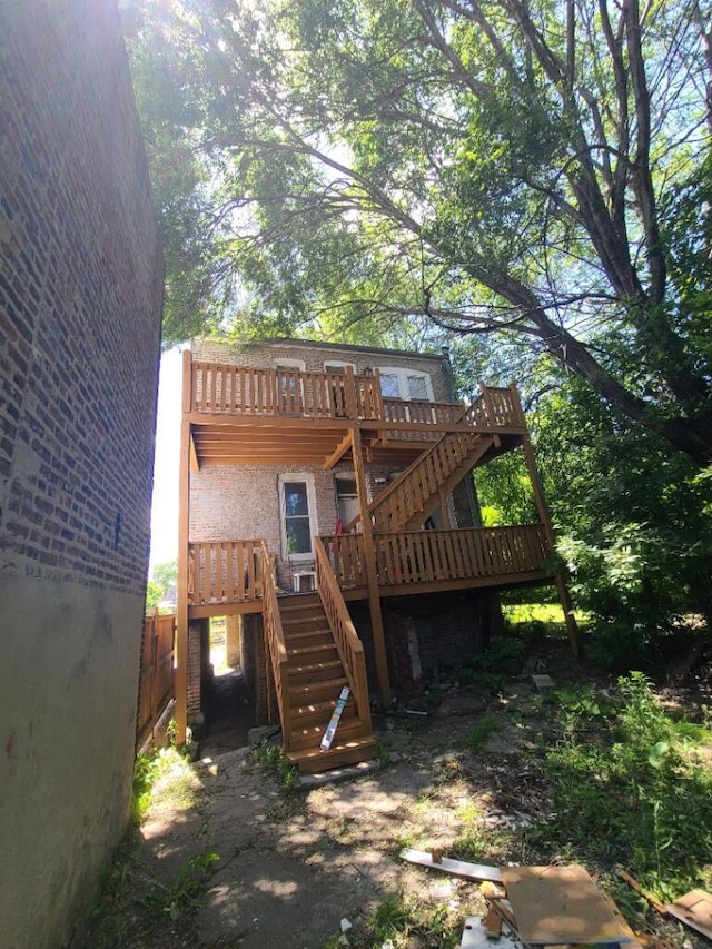 rear view of house with a wooden deck