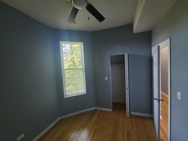 unfurnished bedroom with light wood-type flooring and ceiling fan