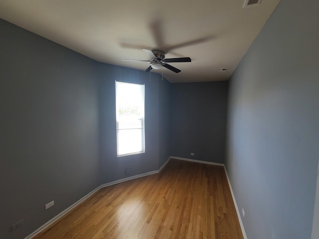 unfurnished room featuring ceiling fan and light wood-type flooring