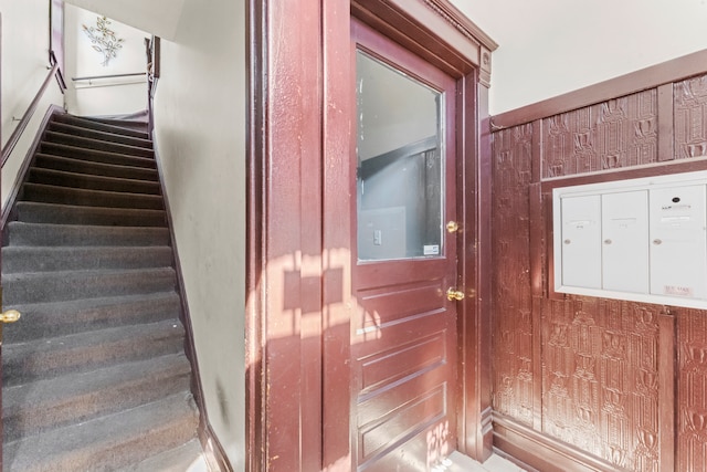 staircase with a mail area