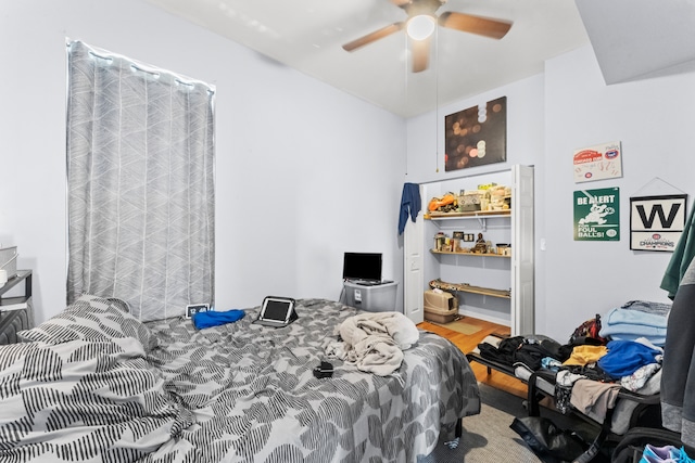 bedroom featuring ceiling fan and hardwood / wood-style flooring