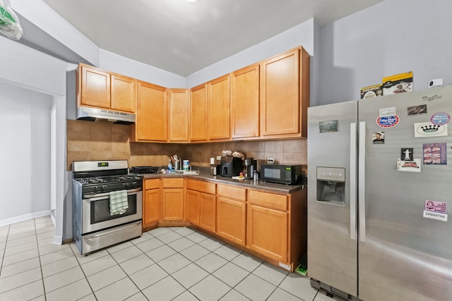 kitchen with backsplash, stainless steel appliances, and light tile patterned flooring