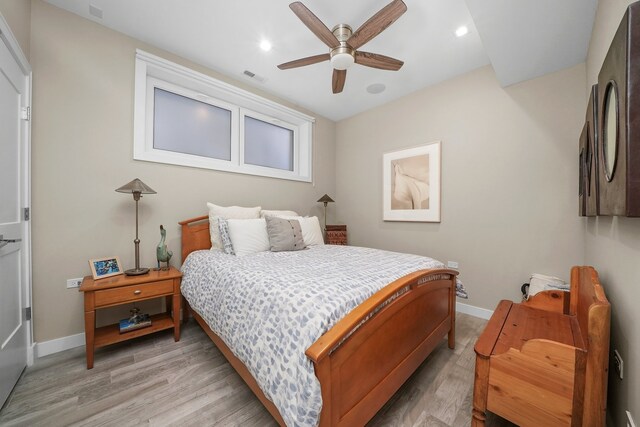 bedroom featuring ceiling fan and light hardwood / wood-style flooring