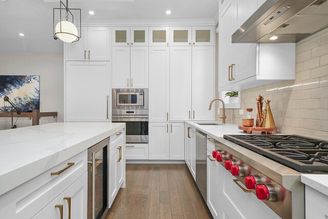 kitchen featuring wine cooler, white cabinets, stainless steel appliances, range hood, and sink