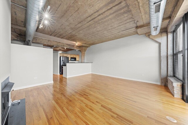 empty room featuring wood-type flooring