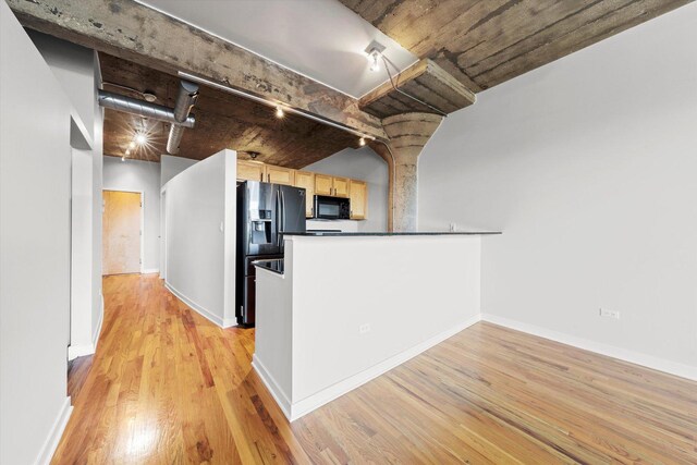 unfurnished living room with light hardwood / wood-style floors