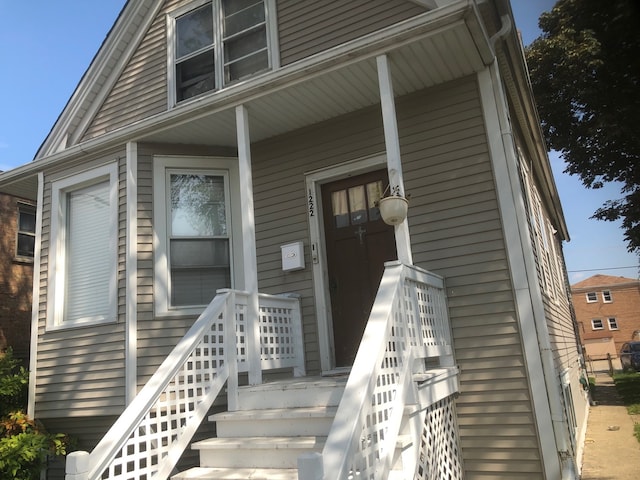 doorway to property with a porch