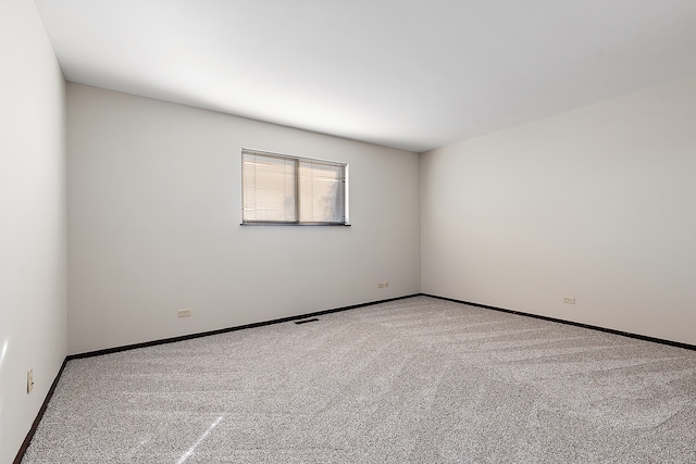 empty room featuring carpet flooring