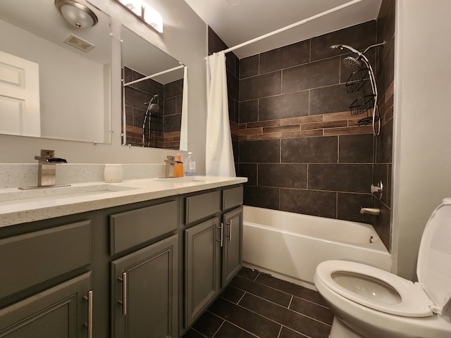 full bathroom with vanity, toilet, shower / bath combo, and tile patterned flooring