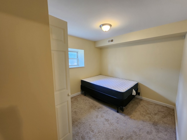 bedroom with light colored carpet