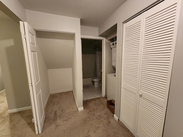 spacious closet featuring light carpet