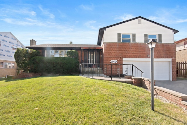 view of front facade with a front yard and a garage