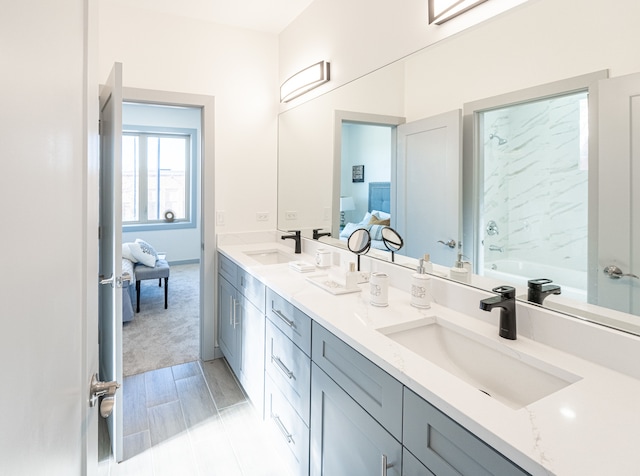 bathroom with vanity and a bathing tub