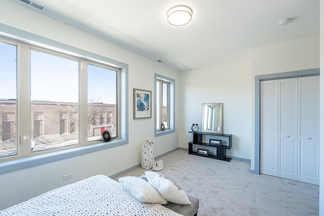 carpeted bedroom featuring a closet