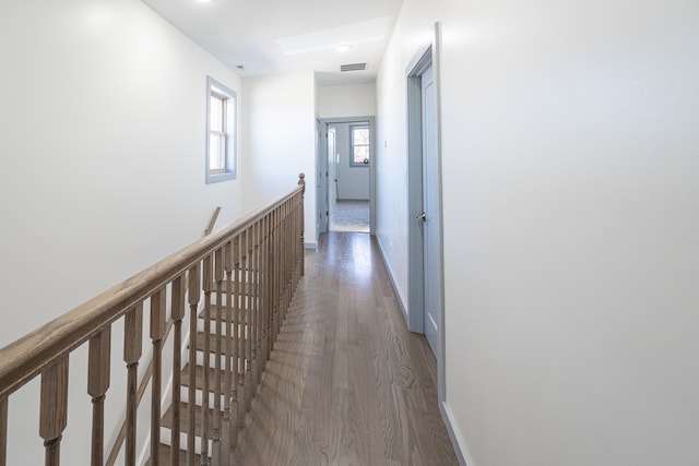 corridor with dark wood-type flooring