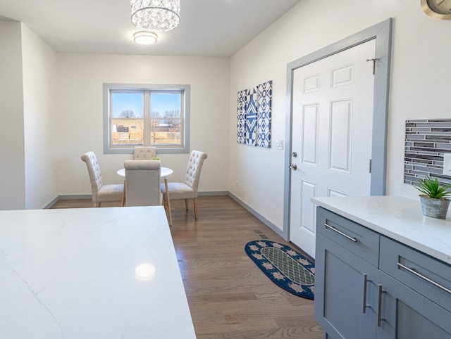 dining area featuring an inviting chandelier and light wood-type flooring