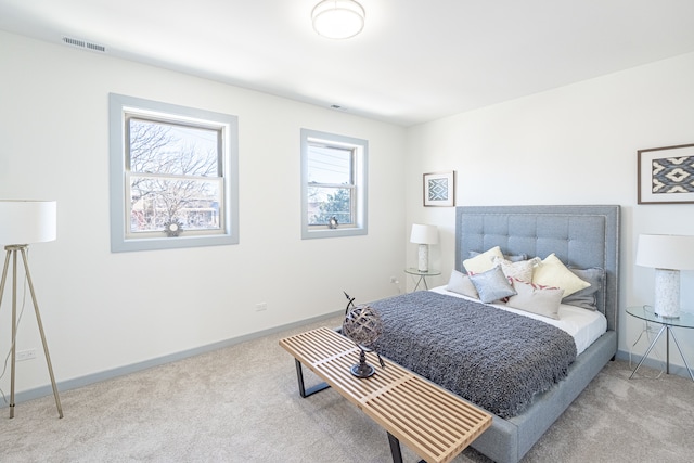 bedroom with light colored carpet