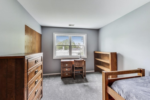bedroom featuring carpet floors and baseboards