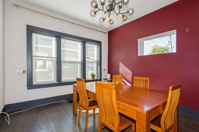 dining area featuring an inviting chandelier, a healthy amount of sunlight, and dark hardwood / wood-style flooring