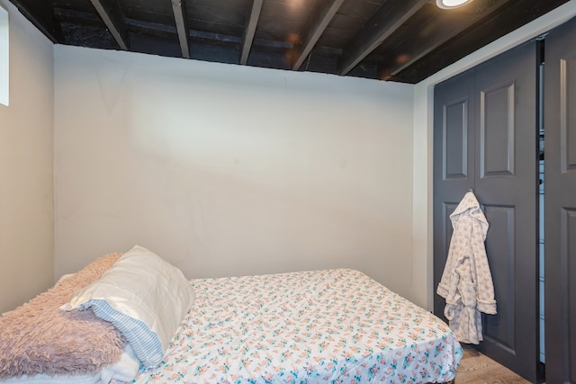 bedroom with wood-type flooring