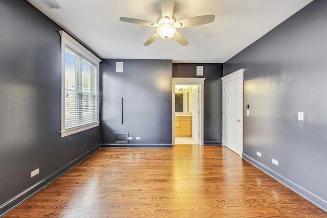 spare room featuring light hardwood / wood-style floors and ceiling fan