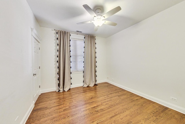 empty room featuring ceiling fan and wood-type flooring