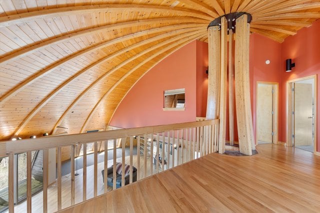 hallway featuring wood ceiling, hardwood / wood-style flooring, high vaulted ceiling, and beam ceiling