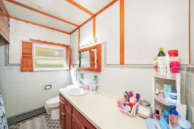 bathroom with toilet, a baseboard radiator, vanity, and tile walls