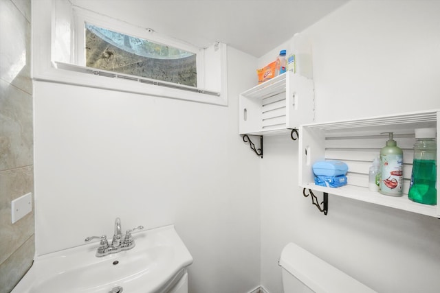 bathroom with toilet and sink