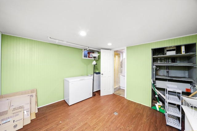 laundry room featuring hardwood / wood-style flooring