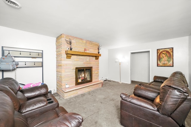 carpeted living room featuring a stone fireplace