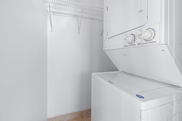 washroom with stacked washer and clothes dryer