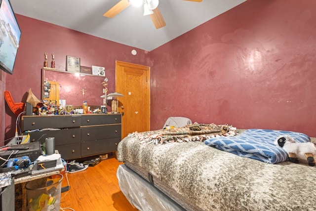 bedroom with wood-type flooring and ceiling fan