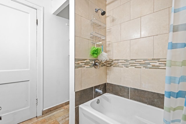 bathroom featuring shower / bath combination with curtain and hardwood / wood-style floors