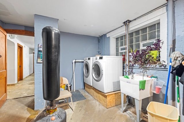 washroom with independent washer and dryer