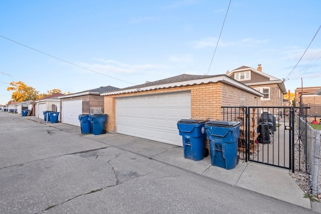 view of home's exterior featuring a garage and an outbuilding