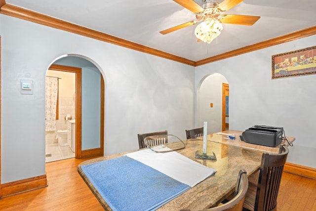 dining room with crown molding, light hardwood / wood-style flooring, and ceiling fan