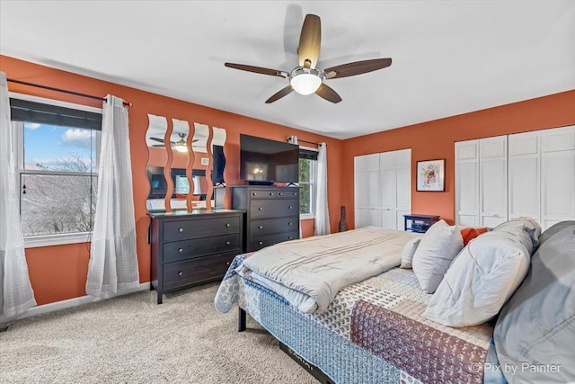 carpeted bedroom with ceiling fan