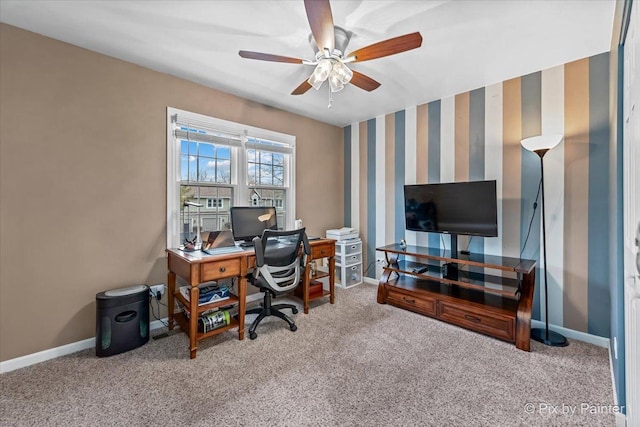 carpeted home office with ceiling fan